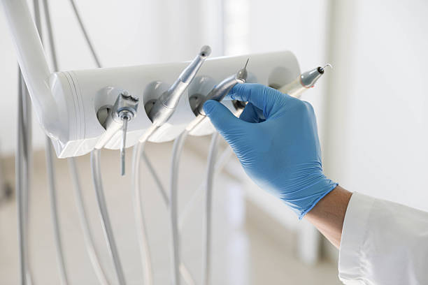 Professional Tooth Extraction technician working in Holly, MI